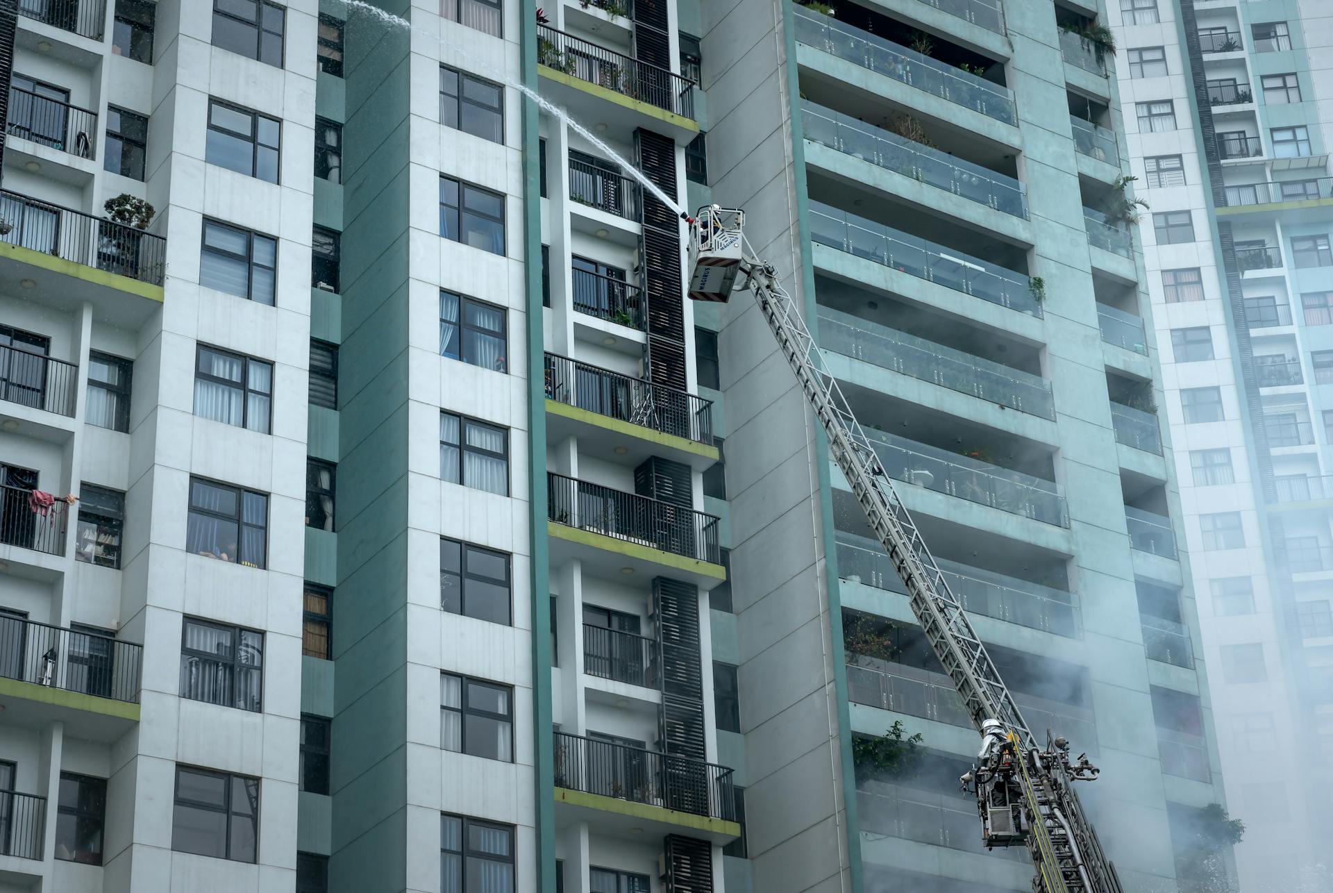 Firefighters Extinguishing a Fire of a Building in City