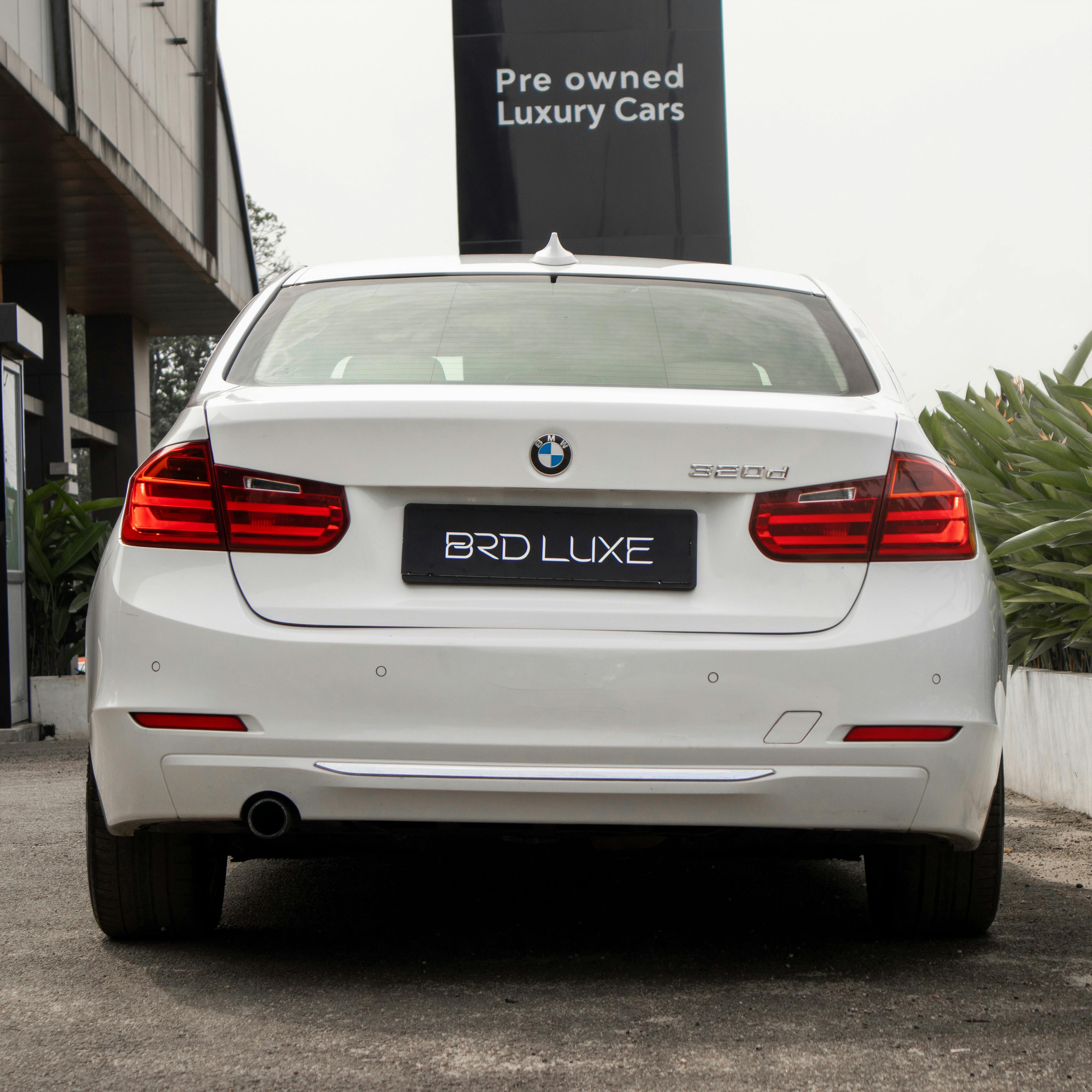 Close Up Photo of White BMW Free Stock Photo