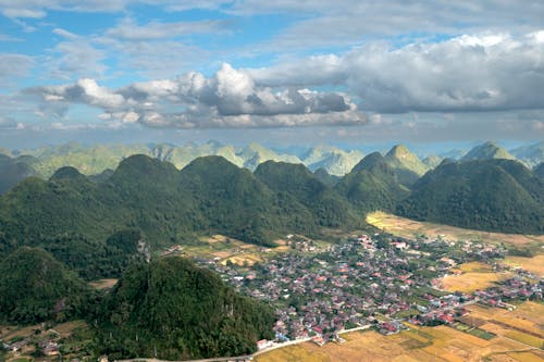 Village and Fields Surrounded by Mountains 