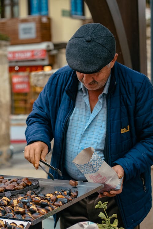 Man Getting Roasted Chestnuts