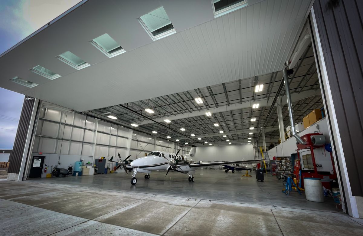 Aircraft covered and stored in a clean, dry hangar with proper ventilation
