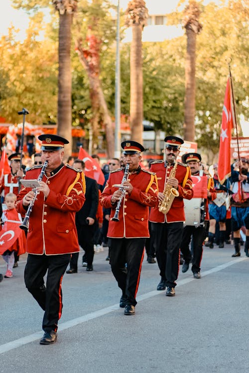 Wind Orchestra in Uniforms Parading in the Street 