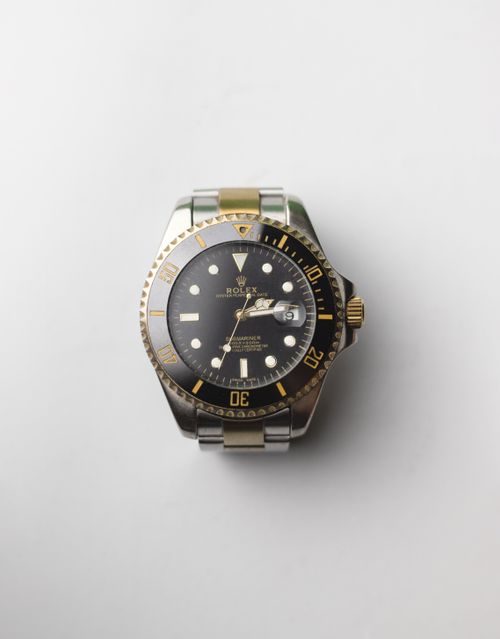 Free Close-up of a luxury Rolex wristwatch on a white surface. Stock Photo