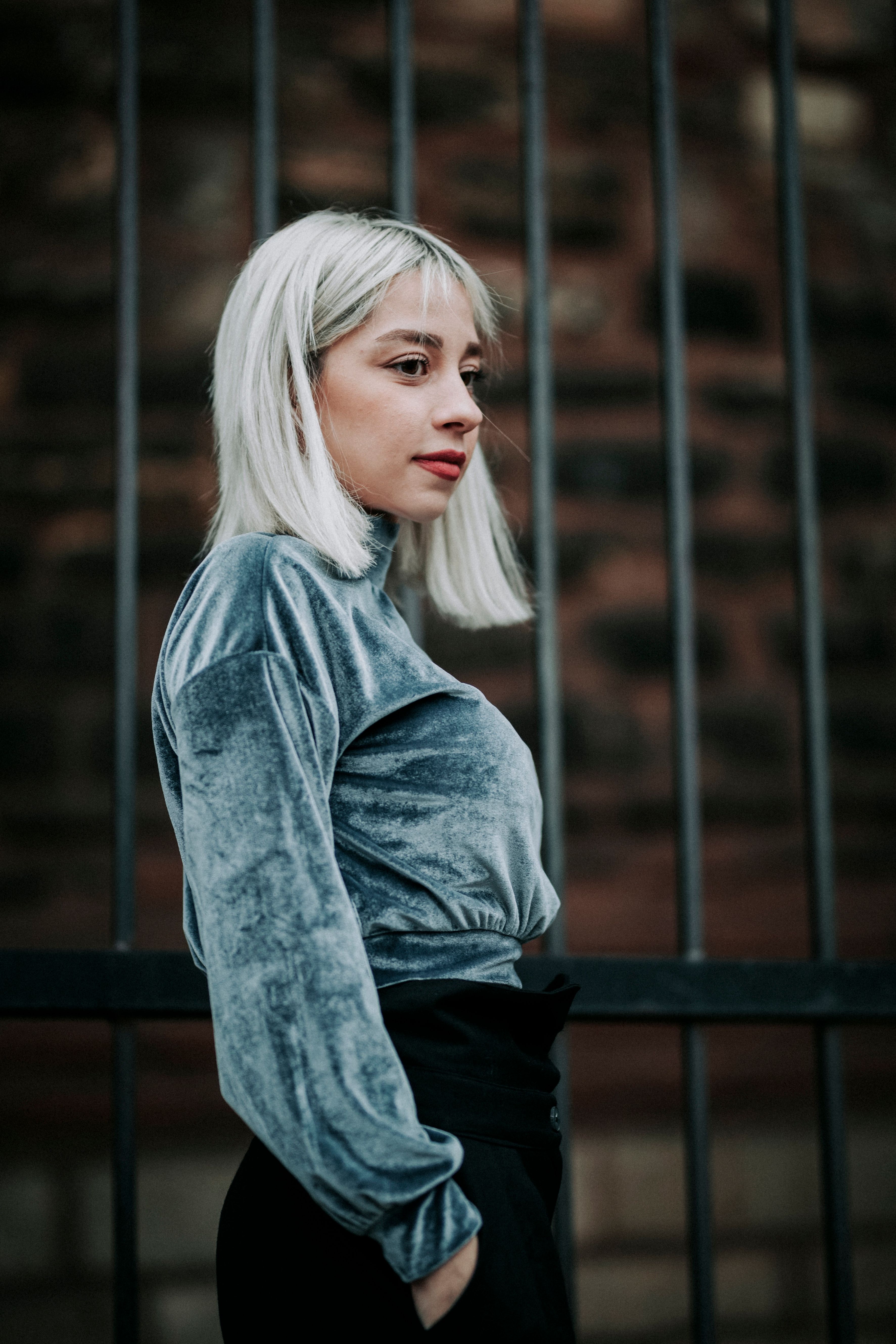 A Woman in White Long Sleeves Shirt and Gray Sweater · Free Stock Photo