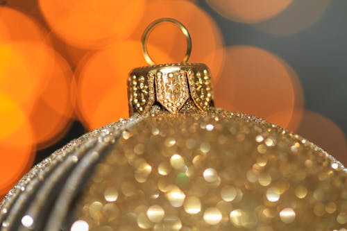 Close-Up Photograph of a Gold Christmas Ball