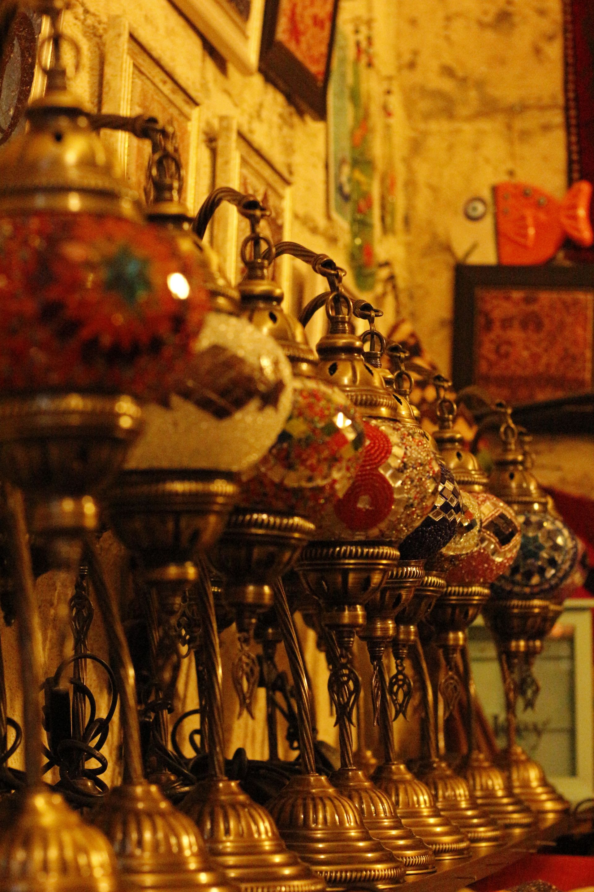 Traditional Turkish mosaic lamps glowing in a row