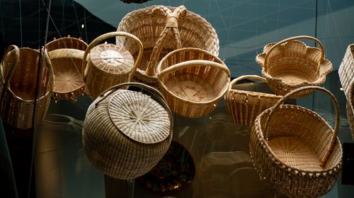 Free Low angle shot of intricately woven wicker baskets hanging indoors. Stock Photo