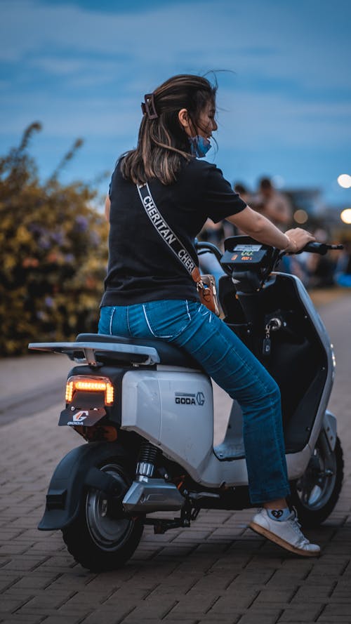 Woman Travelling on a Motorbike 