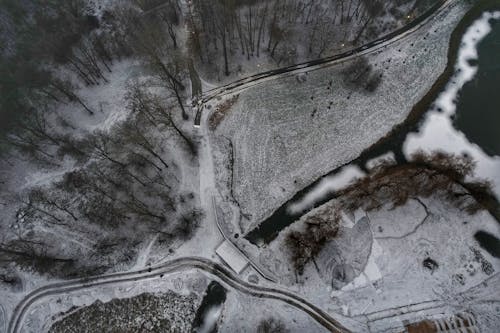 Aerial Shot Forest Road Covered with Snow 