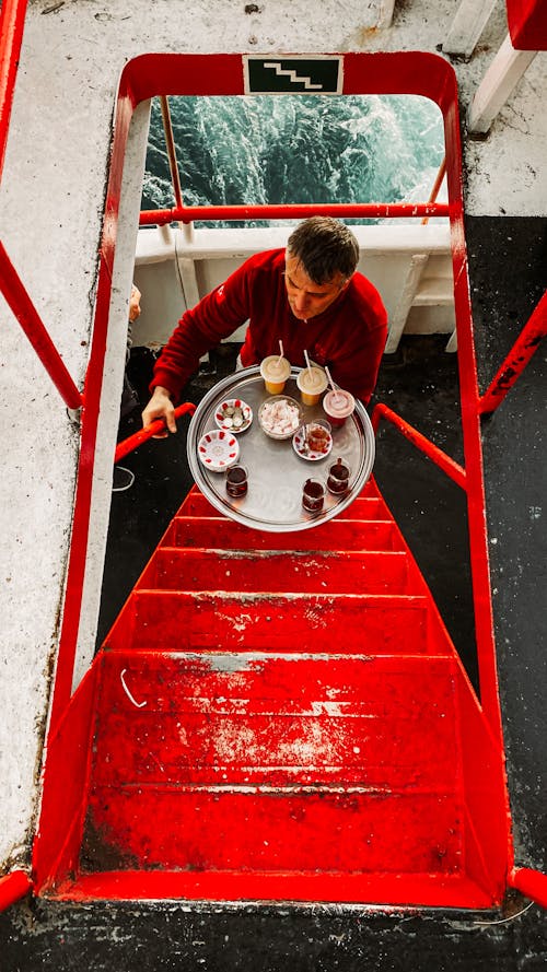 Waiter on Stairs on Ship