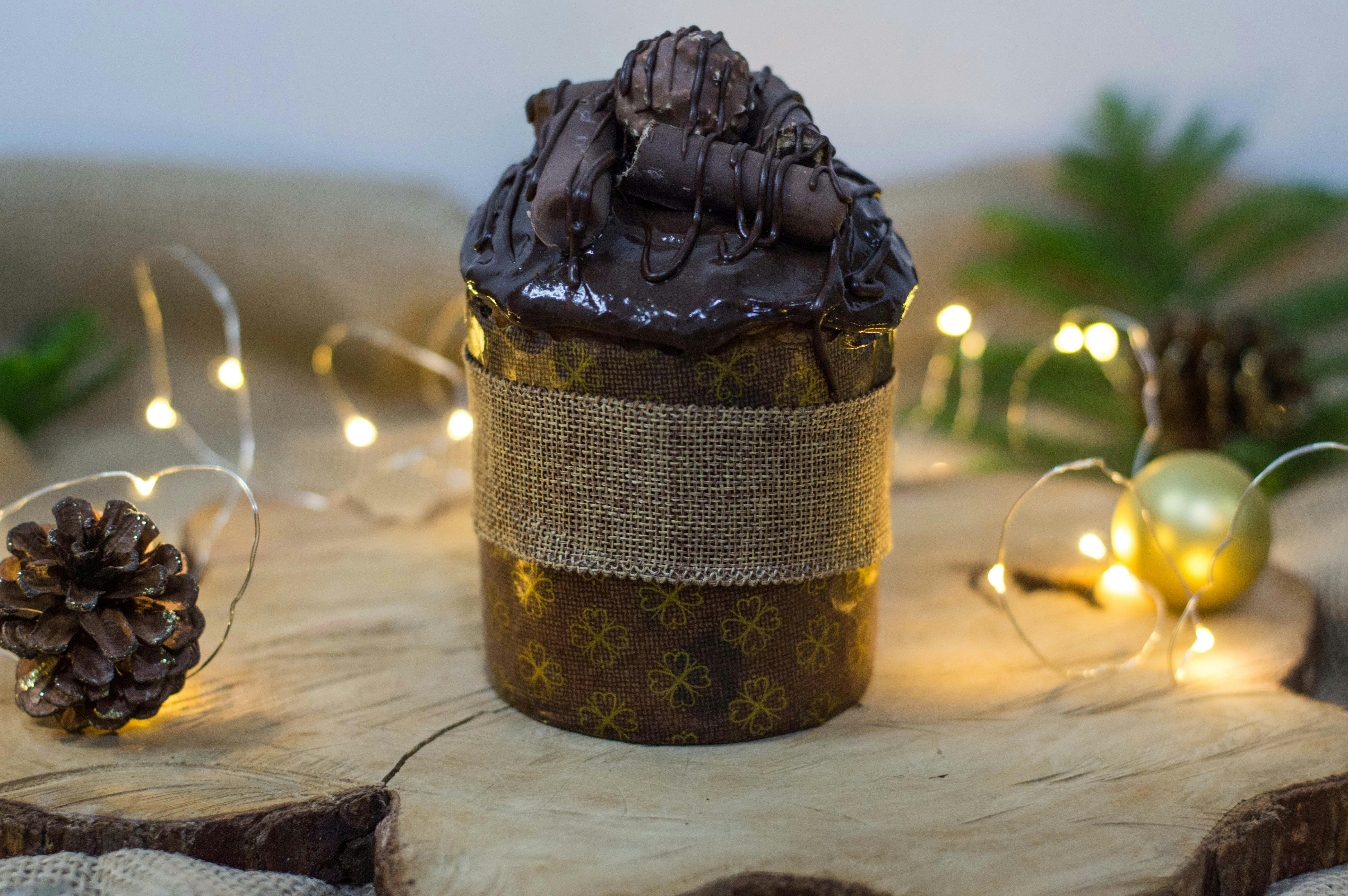 close up of a chocolate cake among christmas decorations