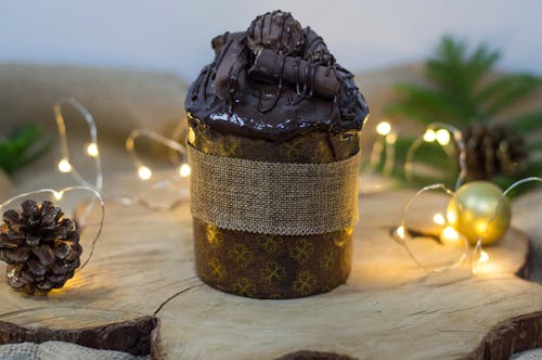 Close-up of a Chocolate Cake among Christmas Decorations 