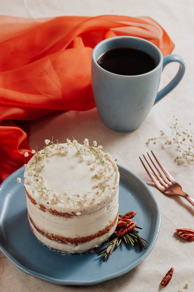 A Carrot Cake With Cup Of Coffee