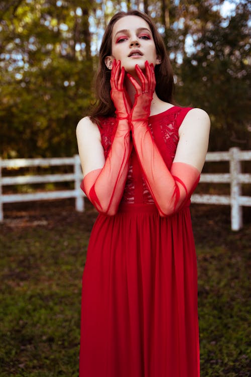 Model posing in Red Dress and Gloves