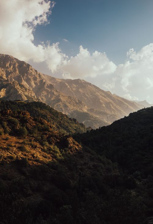 Free Breathtaking view of mountains and valleys at dawn with dramatic clouds and lighting. Stock Photo