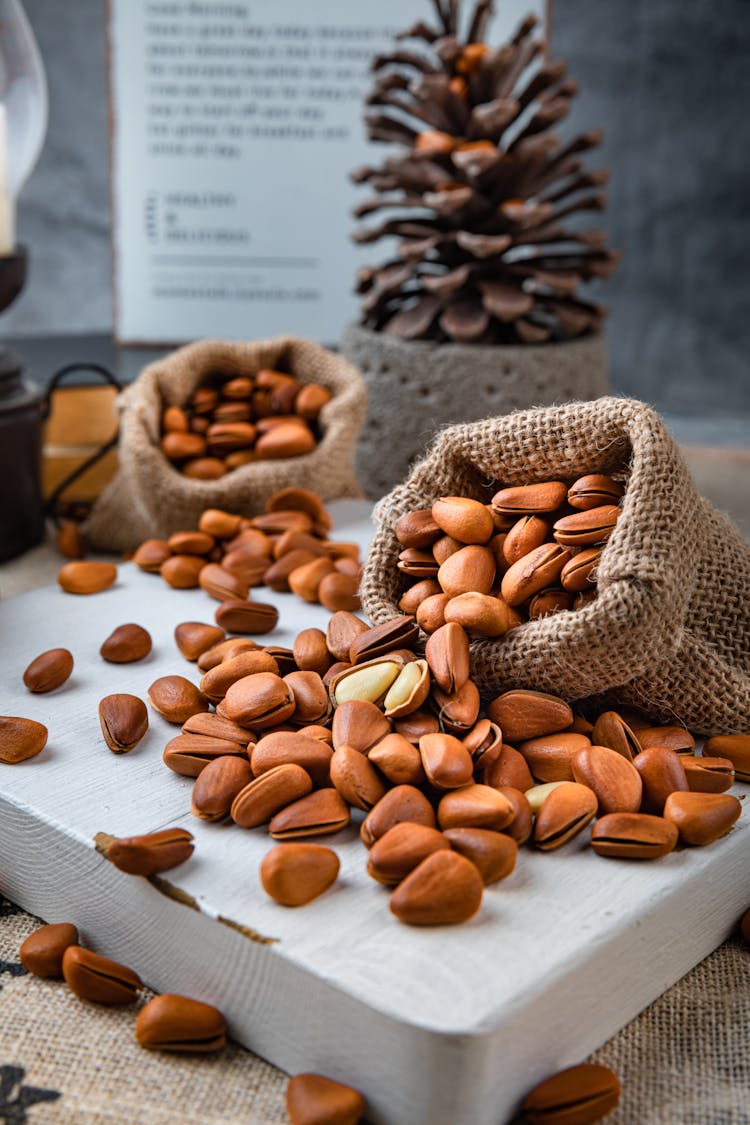 Pine Nuts On Burlap Sacks