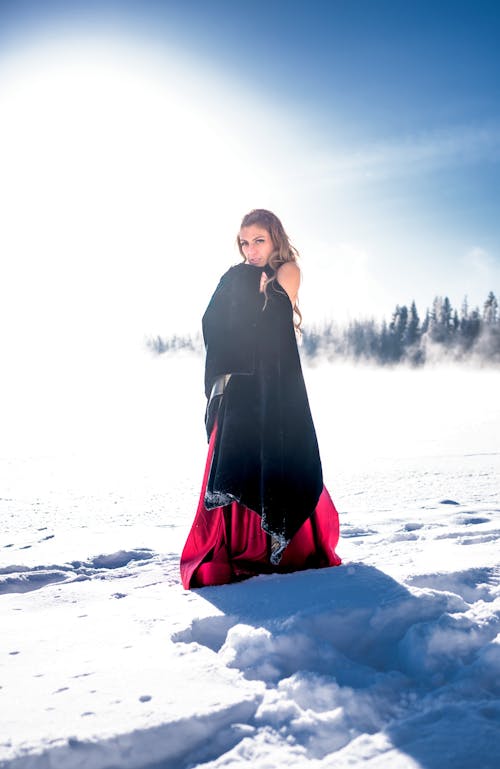 Woman Posing in Dress on Snow