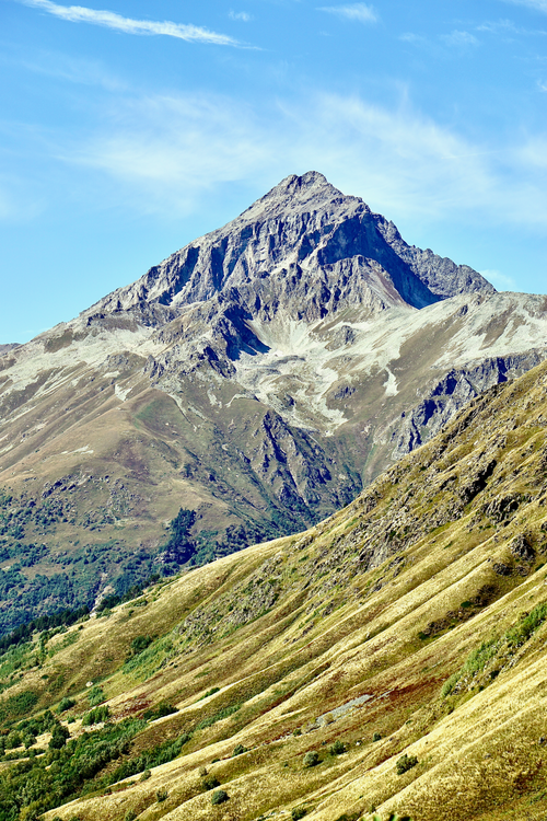 Free Stunning view of a mountain summit under clear blue skies, ideal for nature lovers. Stock Photo