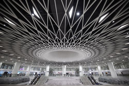 Free Modern architecture and escalators in Gangxia North Station, Shenzhen, China. Stock Photo