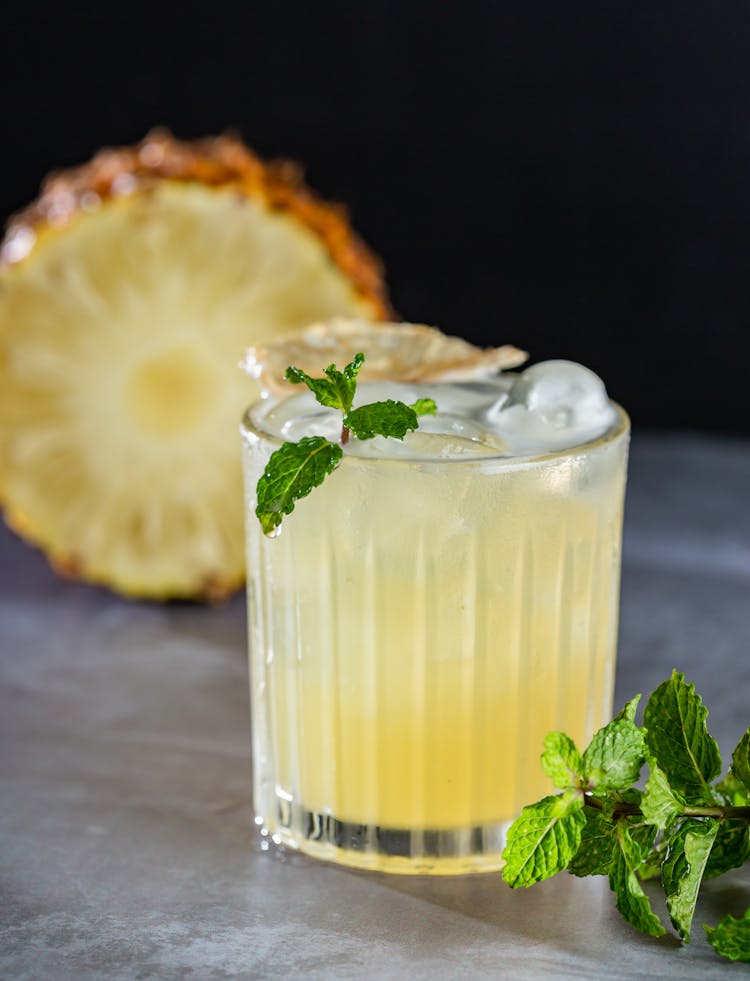 Glass Of Pineapple Juice With Ice Cubes And Mint