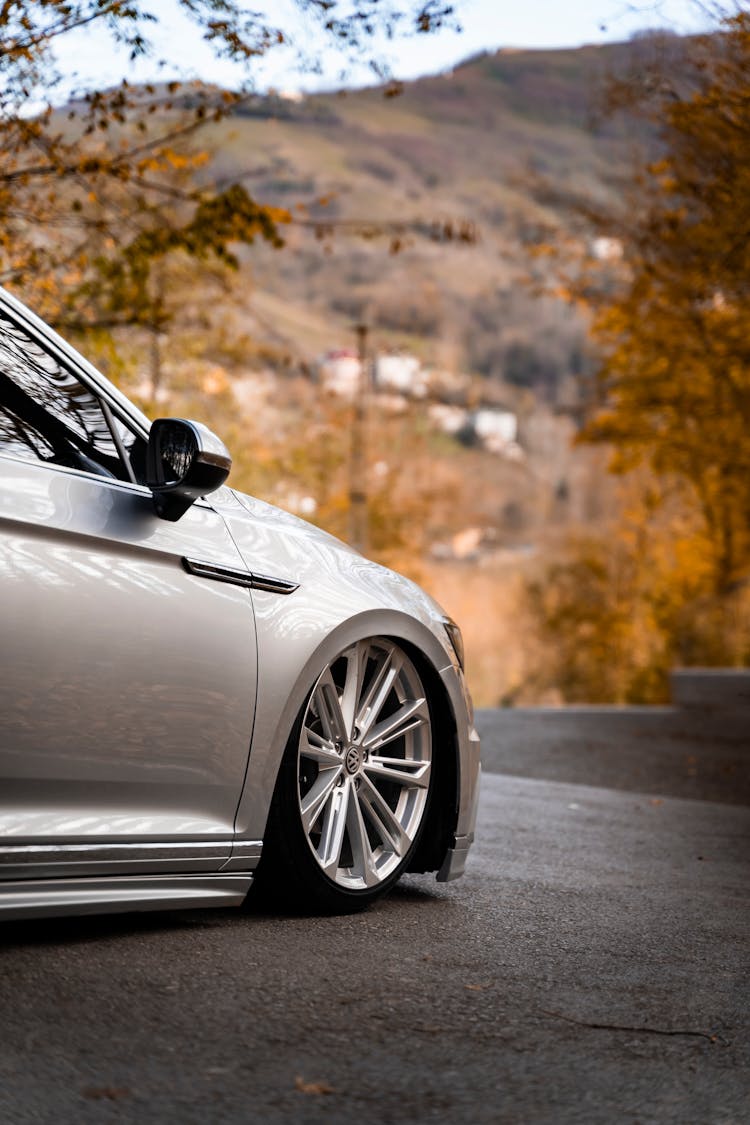 A Silver Car On The Road