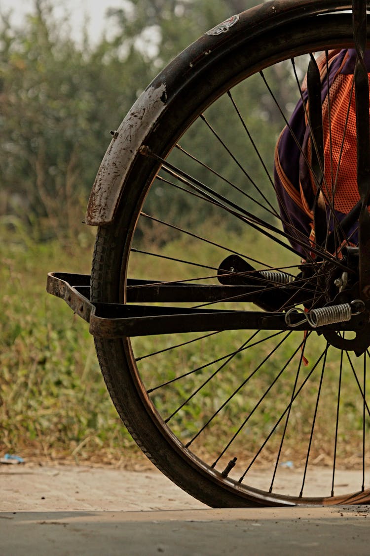 A Wheel Of A Bicycle With Stand