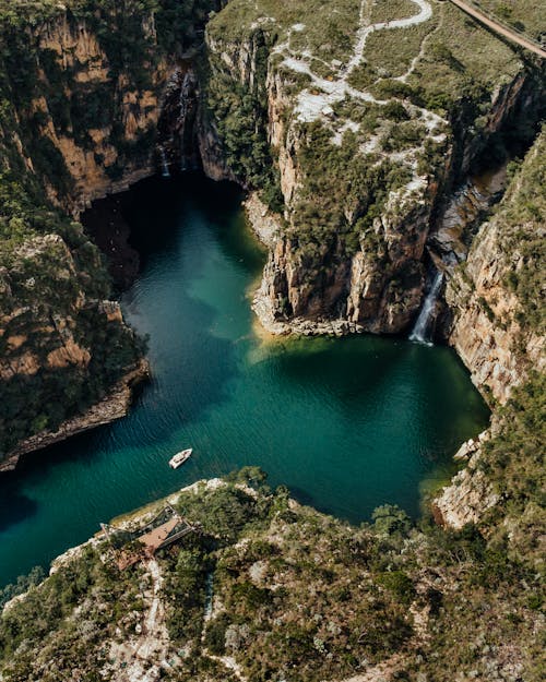 Aerial View of a Bay Surrounded by Tall Cliffs