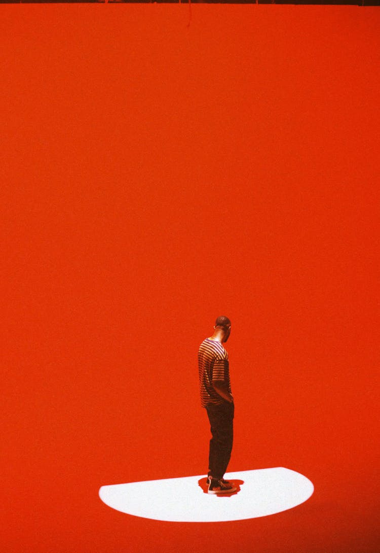 Man Standing On Red Background