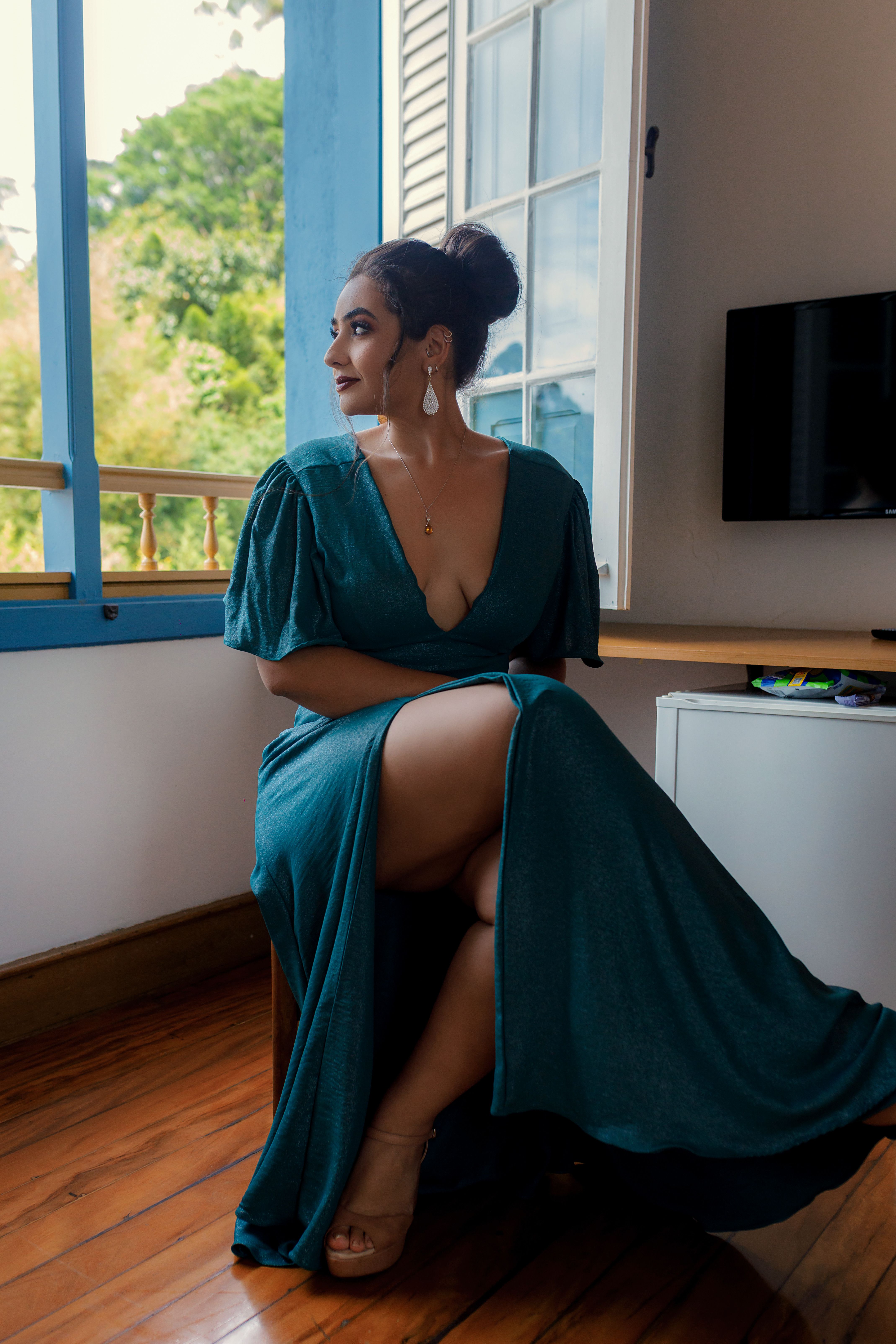 Photograph of a Woman in a Green Dress Sitting · Free Stock Photo