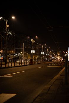 A nighttime view of an empty street in Belgrade, Serbia, showcasing urban lights and city atmosphere.