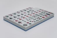 Mahjong Tiles on the White Surface