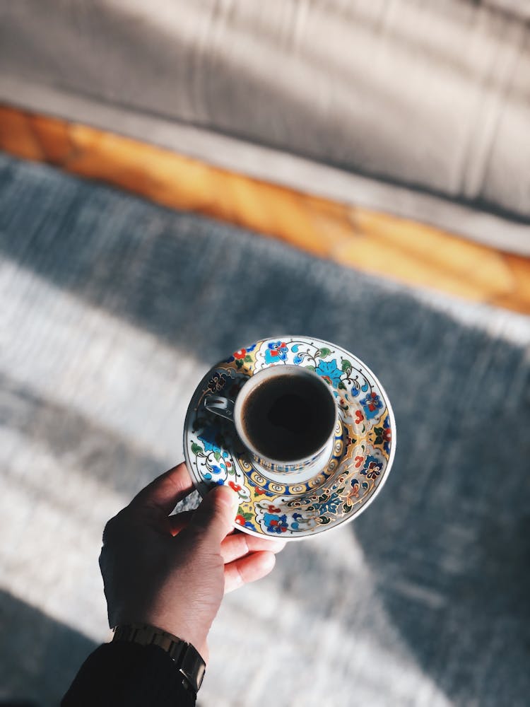 Man Holding Cup With Black Coffee