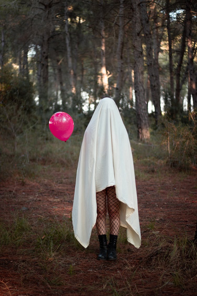 Ghost With Balloon In Forest