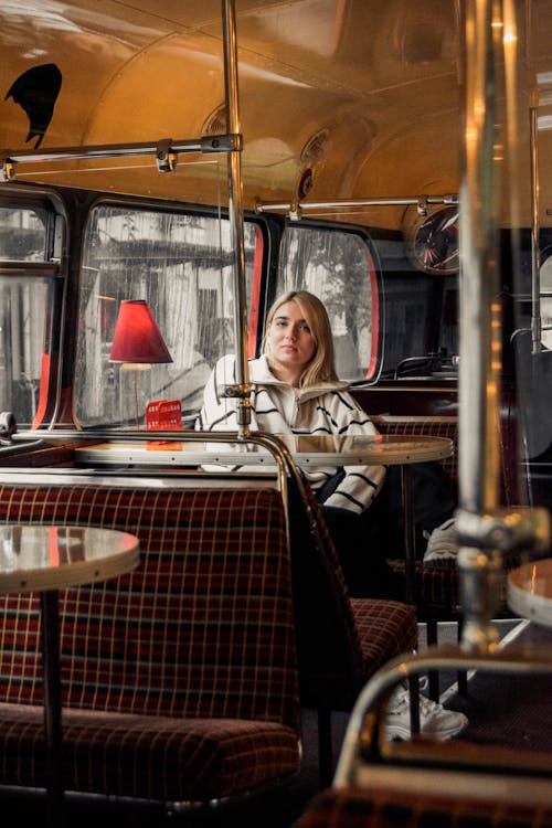 A Woman Sitting at the Table