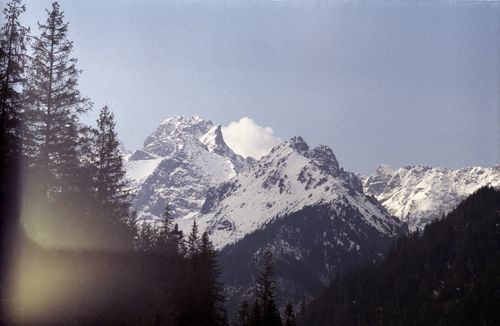 Free Aerial view of snow-covered Tatra Mountains in Zakopane, Poland, under clear skies. Stock Photo