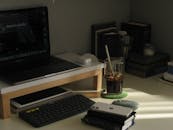 Laptop and Gadgets on Home Office Table