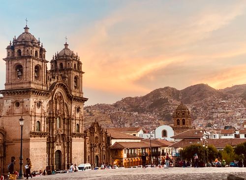 Free Stunning view of a historic church in Cusco at sunset, with vibrant skies and cityscape. Stock Photo