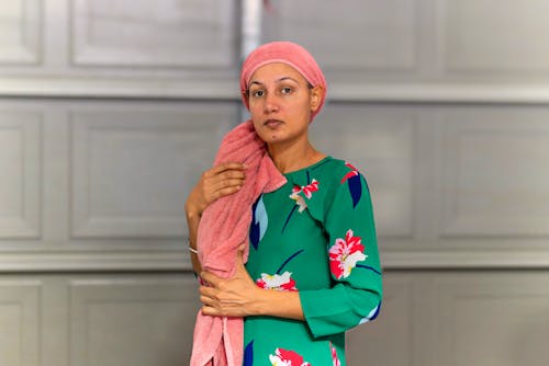 Photo of a Woman with a Pink Head Towel