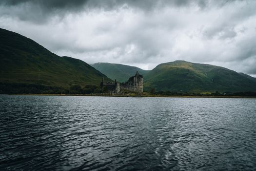 Kilchurn Castle in Scotland under the Cloudy Sky
