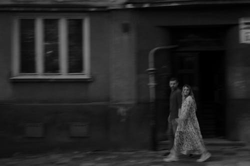 Monochrome Photograph of a Couple Walking on the Street