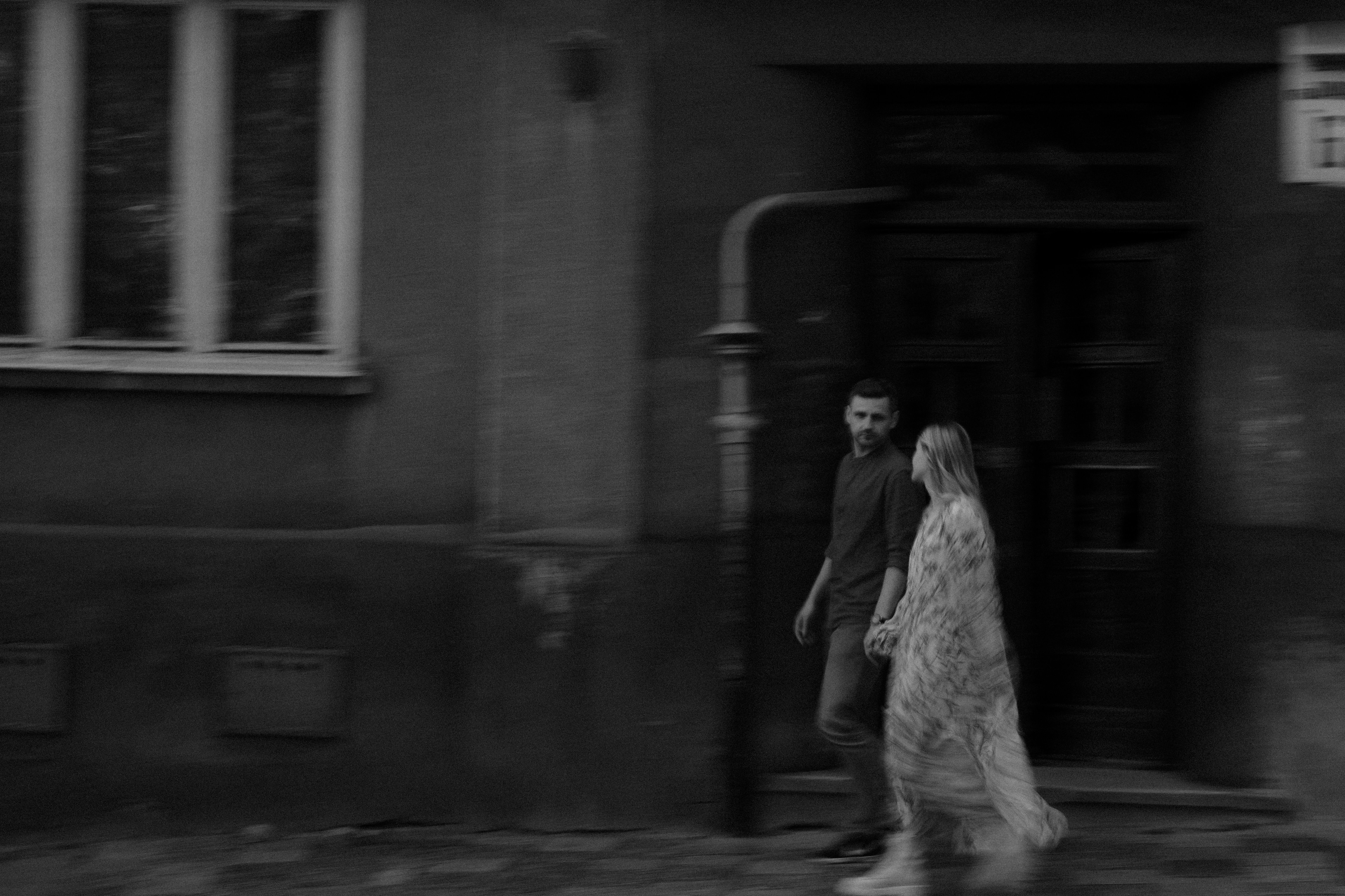 Grayscale Photo of a Couple Walking on the Sidewalk · Free Stock Photo