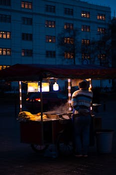 A night-time shot of a street vendor selling corn in Istanbul, Turkey.