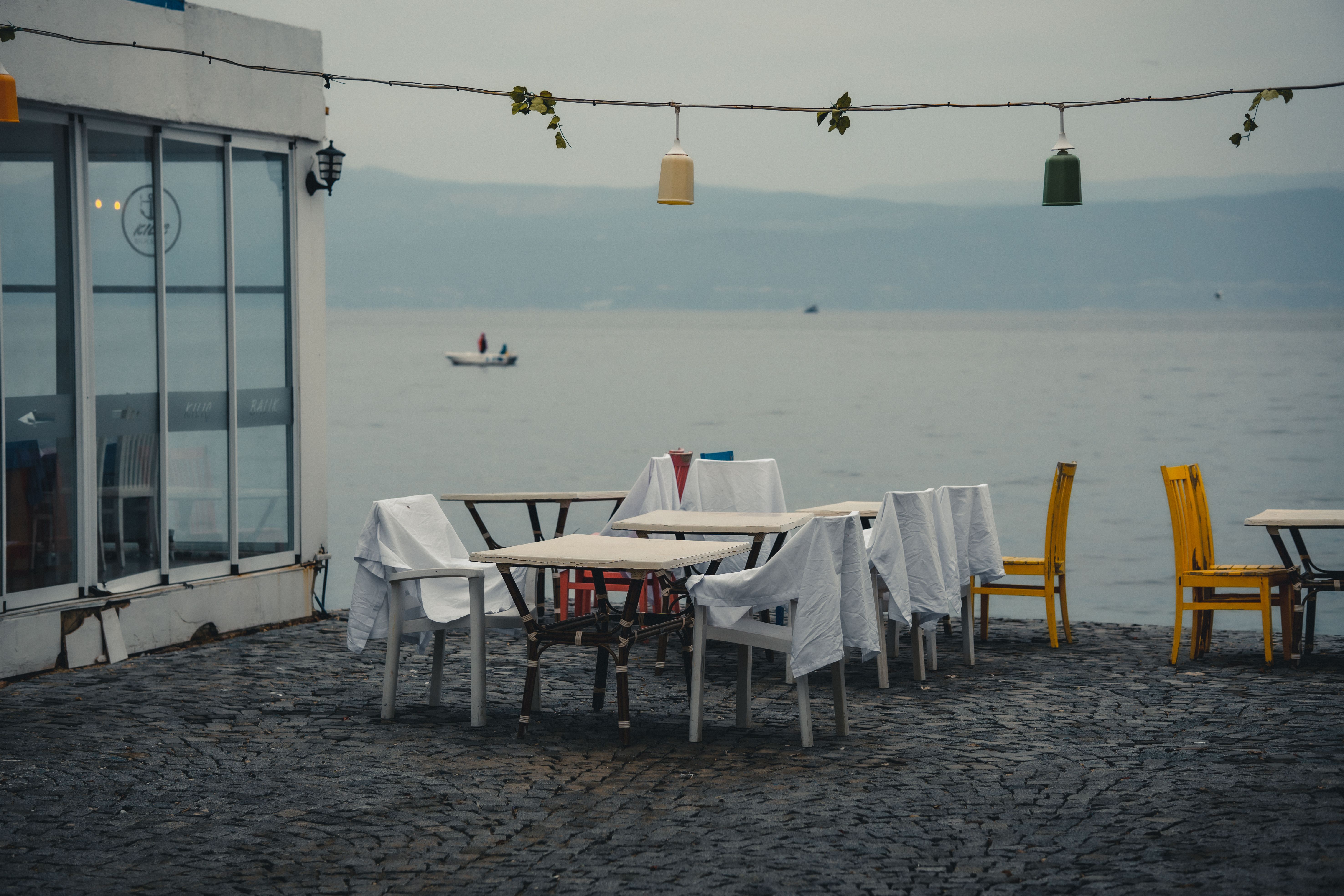 An empty dining table under overcast light