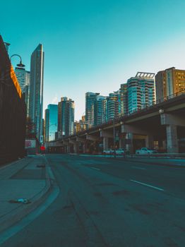 Explore Toronto's stunning skyline with modern skyscrapers at dawn, featuring urban architecture and vibrant city life.