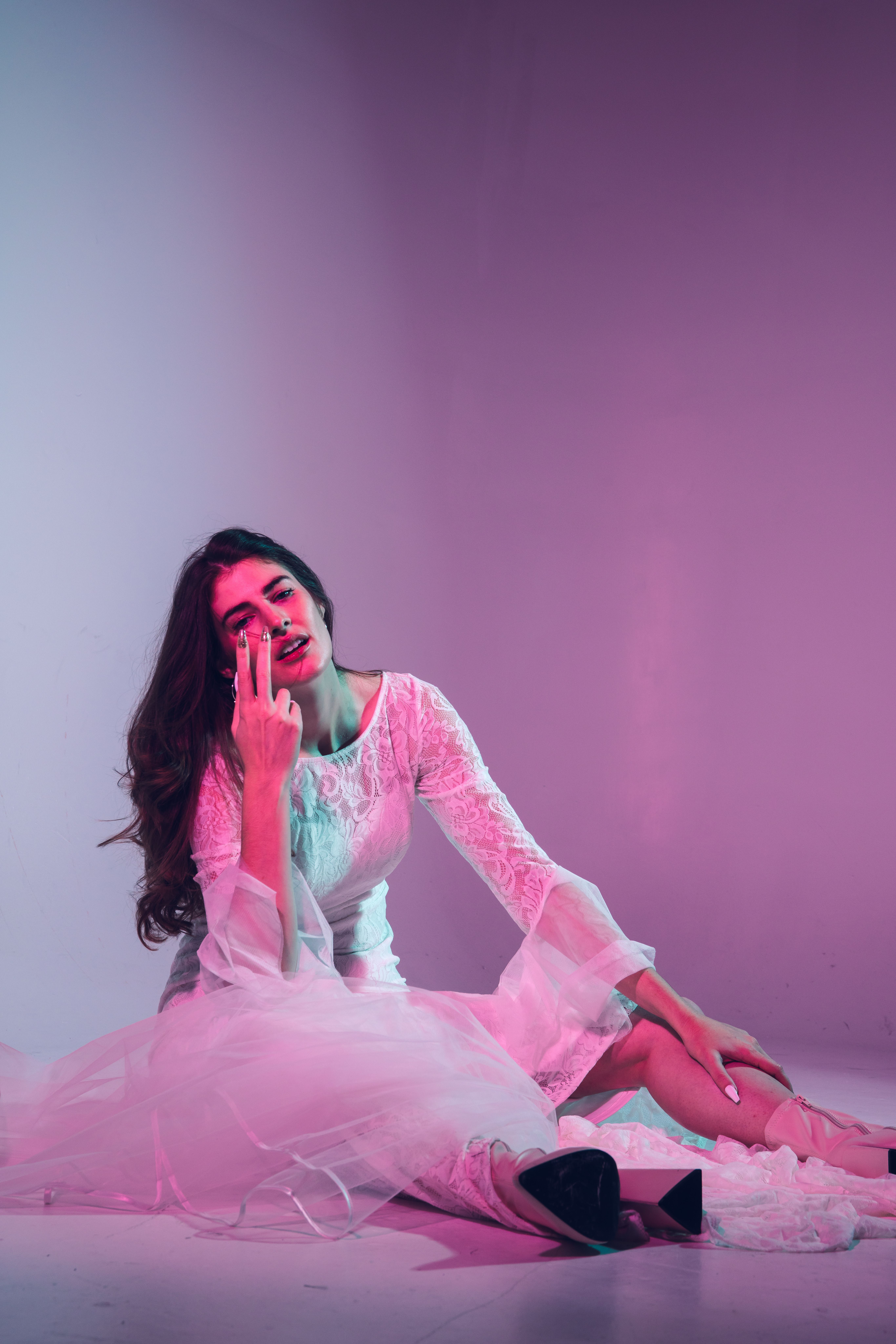 A Woman wearing White Dress Sitting on the Floor · Free Stock Photo