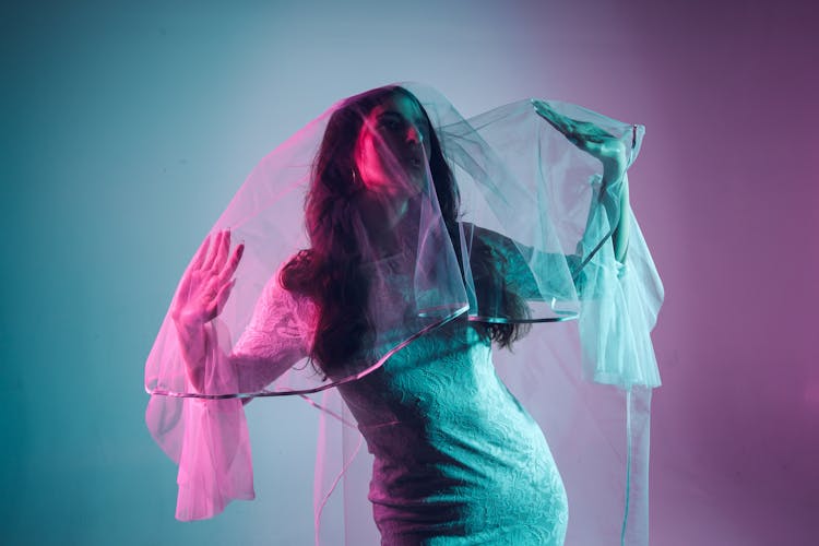 Woman In White Lace Dress And Veil