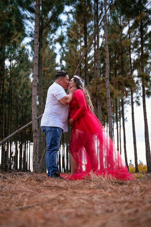 A Low Angle Shot of a Couple Kissing Each Other