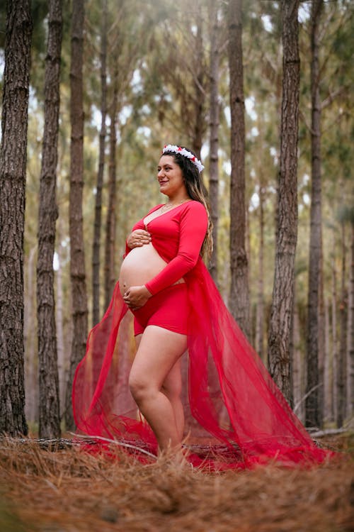 A Woman Pregnant Woman in Red Dress