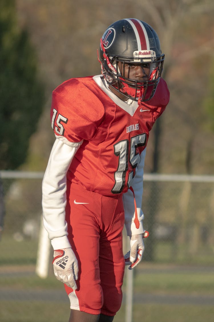 Man In Red And White Football Uniform