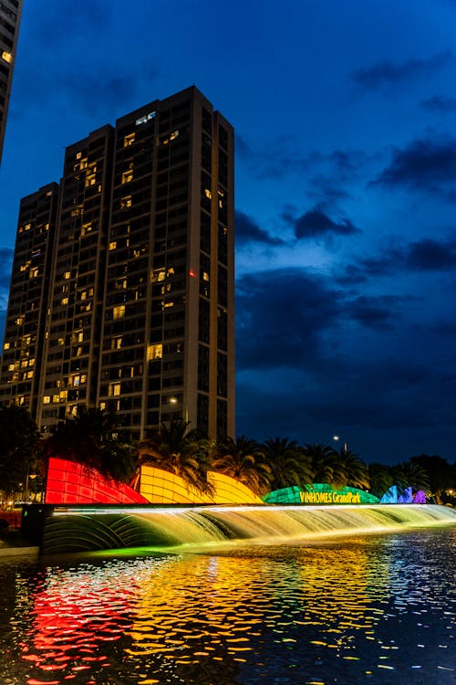 Colorful Fountains in City in Evening